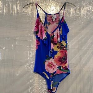 See Video: Floral Bodysuit